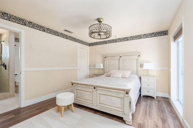 14215 Killarney Dr, Madera, CA 93636 - bedroom featuring wood finished floors, baseboards, and a chandelier
