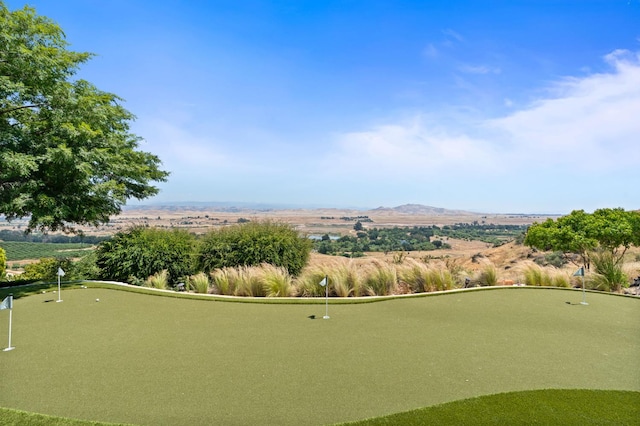 14215 Killarney Dr, Madera, CA 93636 - surrounding community featuring a putting green and a mountain view