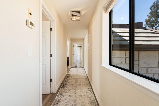 14215 Killarney Dr, Madera, CA 93636 - hall featuring healthy amount of natural light, wood finished floors, and baseboards