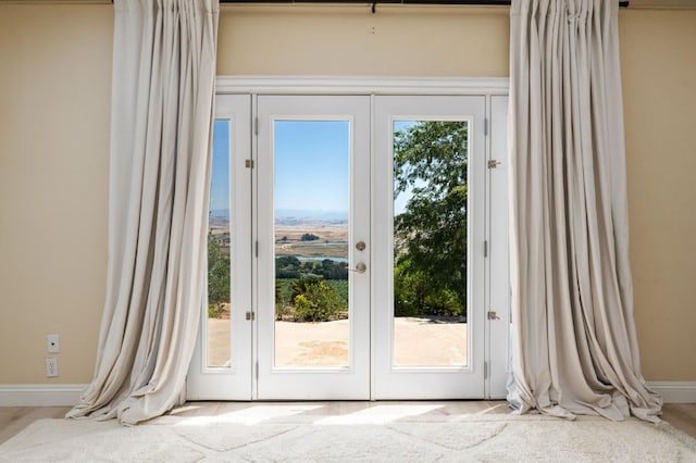 14215 Killarney Dr, Madera, CA 93636 - doorway to outside featuring baseboards and french doors