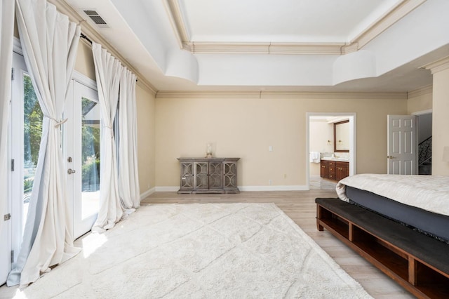 14215 Killarney Dr, Madera, CA 93636 - bedroom featuring crown molding, access to exterior, a raised ceiling, wood finished floors, and ensuite bath