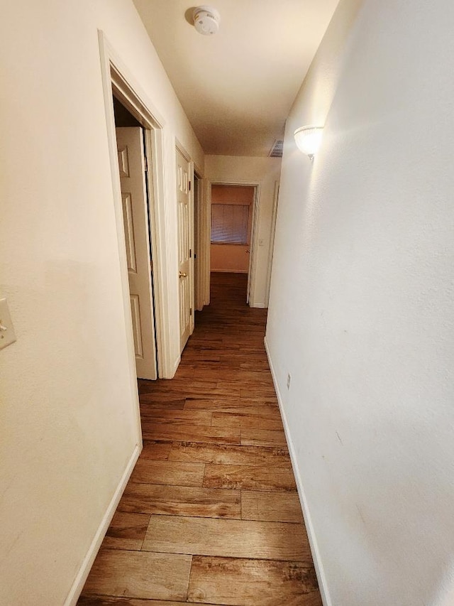 4686 W Sierra Ave, Fresno, CA 93722 - hall with light wood finished floors and baseboards