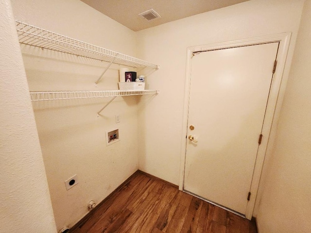4686 W Sierra Ave, Fresno, CA 93722 - laundry room with wood finished floors, electric dryer hookup, and hookup for a washing machine