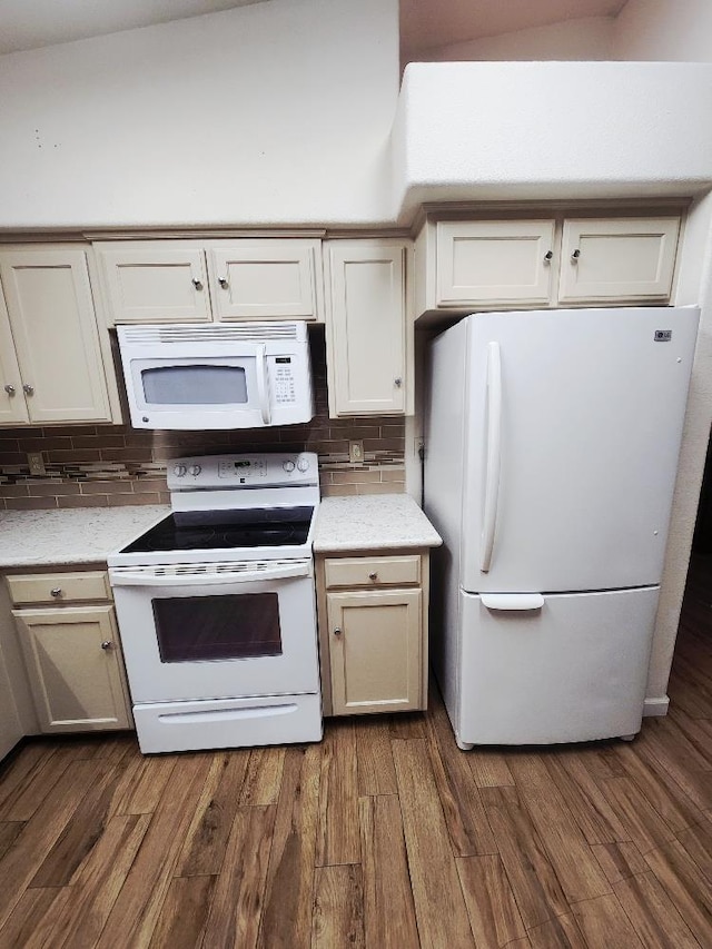 4686 W Sierra Ave, Fresno, CA 93722 - kitchen with white appliances, tasteful backsplash, dark wood-style floors, and light stone counters