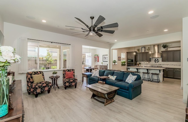 1523 N Ryan Ave, Clovis, CA 93619 - living room featuring light wood-style floors, a ceiling fan, and recessed lighting
