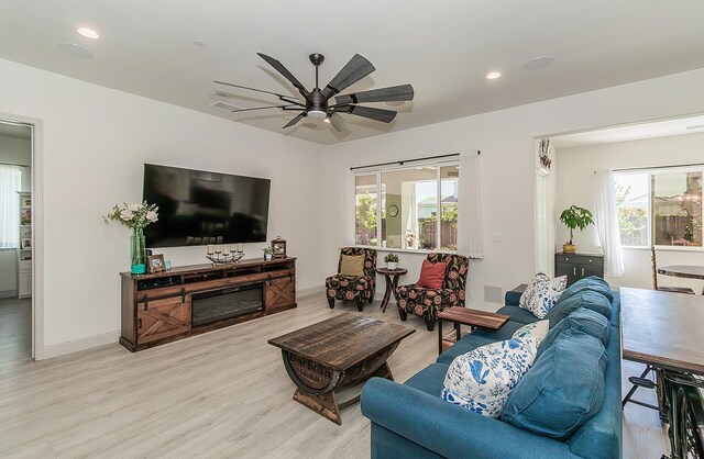 1523 N Ryan Ave, Clovis, CA 93619 - living area with wood finished floors, healthy amount of natural light, ceiling fan, baseboards, and recessed lighting
