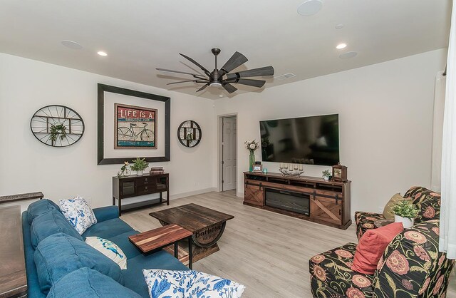 1523 N Ryan Ave, Clovis, CA 93619 - living area featuring light wood-style flooring, ceiling fan, recessed lighting, and baseboards
