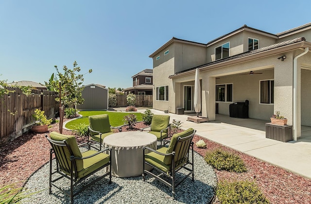 1523 N Ryan Ave, Clovis, CA 93619 - fenced backyard with a ceiling fan and a patio area