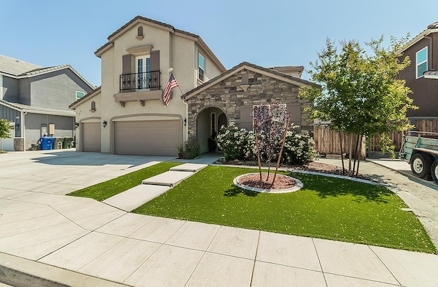 1523 N Ryan Ave, Clovis, CA 93619 - view of front of home with a balcony, a garage, stucco siding, stone siding, and concrete driveway
