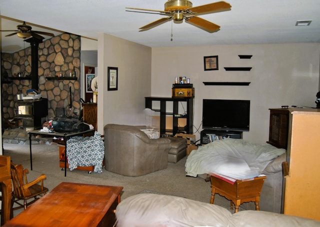 43379 Leach Rd, Ahwahnee, CA 93601 - living room with ceiling fan, carpet flooring, and a wood stove