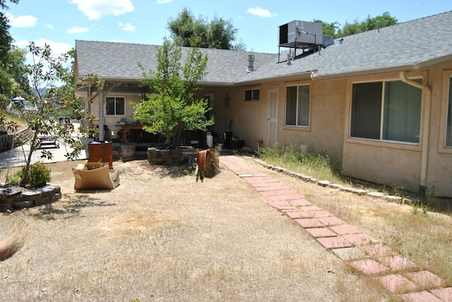 43379 Leach Rd, Ahwahnee, CA 93601 - back of house with roof with shingles and stucco siding