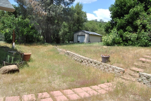 43379 Leach Rd, Ahwahnee, CA 93601 - view of yard featuring an outdoor structure and a detached garage