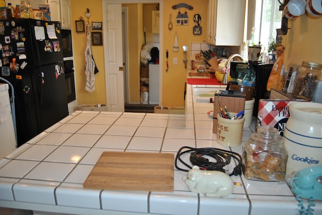 43379 Leach Rd, Ahwahnee, CA 93601 - kitchen featuring tile counters and black appliances