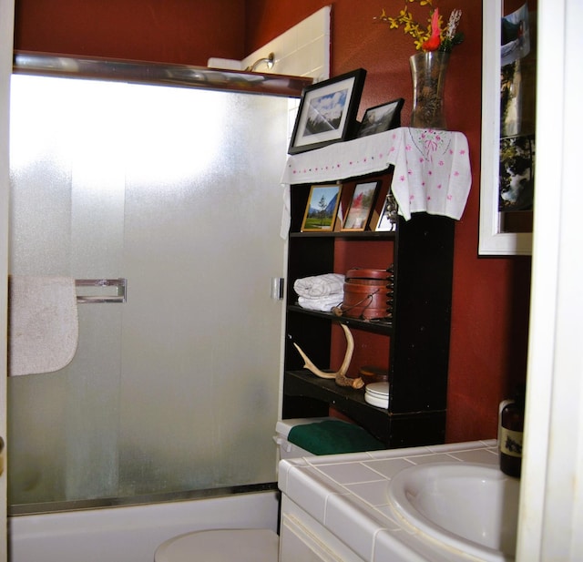 43379 Leach Rd, Ahwahnee, CA 93601 - bathroom featuring vanity, toilet, and enclosed tub / shower combo