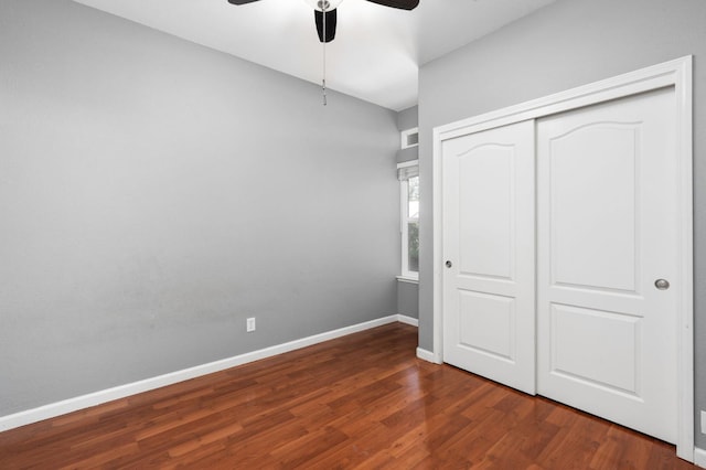 8574 N Heartland Way, Fresno, CA 93720 - unfurnished bedroom with dark wood finished floors, a closet, baseboards, and a ceiling fan