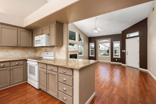 8574 N Heartland Way, Fresno, CA 93720 - kitchen with white appliances, ceiling fan, dark wood-type flooring, a peninsula, and decorative backsplash