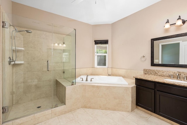 8574 N Heartland Way, Fresno, CA 93720 - full bath featuring a garden tub, a stall shower, vanity, tile patterned flooring, and a ceiling fan
