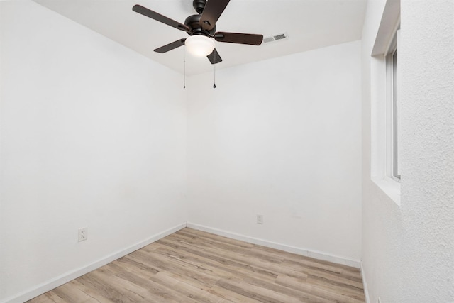 8574 N Heartland Way, Fresno, CA 93720 - spare room with ceiling fan, light wood-type flooring, and baseboards