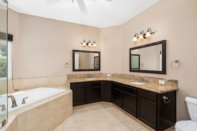 8574 N Heartland Way, Fresno, CA 93720 - bathroom with toilet, ceiling fan, a bath, double vanity, and tile patterned flooring