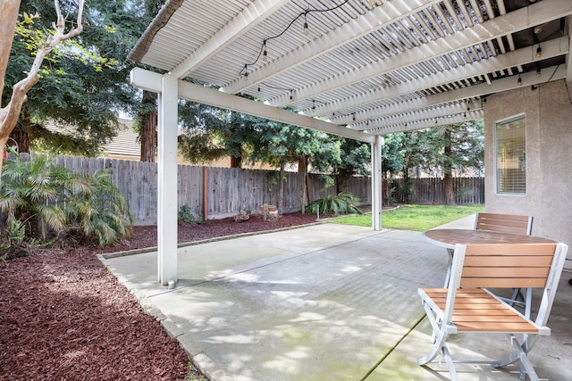 2871 E Ryan Ln, Fresno, CA 93720 - fenced backyard with a pergola, a patio area, and outdoor dining space