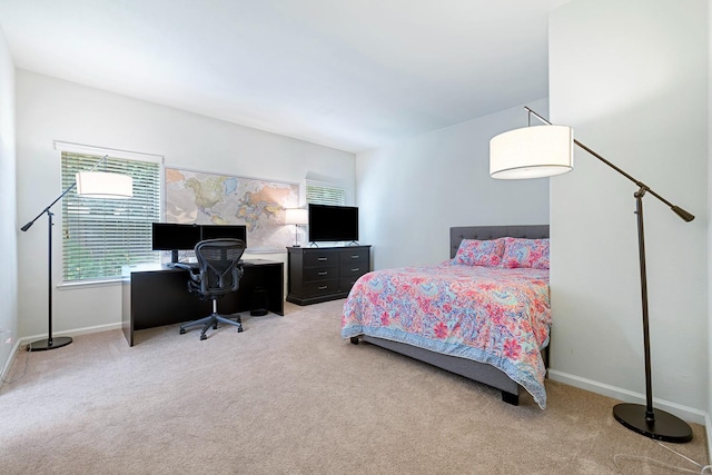 2871 E Ryan Ln, Fresno, CA 93720 - bedroom with light carpet, a desk, and baseboards