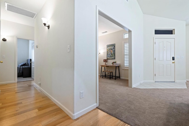 2871 E Ryan Ln, Fresno, CA 93720 - foyer entrance featuring baseboards, light wood-style floors, and light carpet