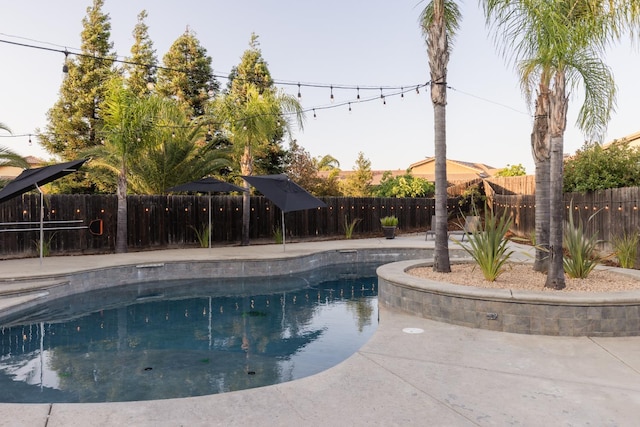 2176 E Pinehurst Ave, Fresno, CA 93730 - view of swimming pool with a fenced backyard