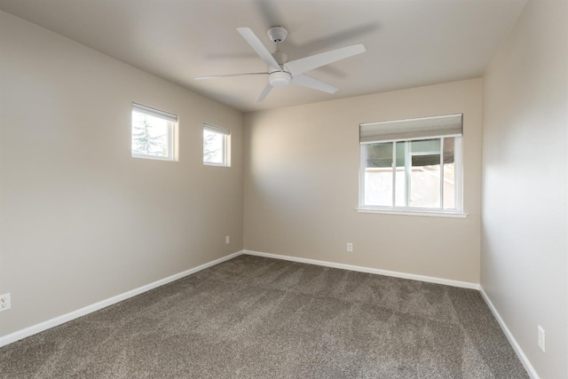 2176 E Pinehurst Ave, Fresno, CA 93730 - empty room with dark carpet, ceiling fan, and baseboards