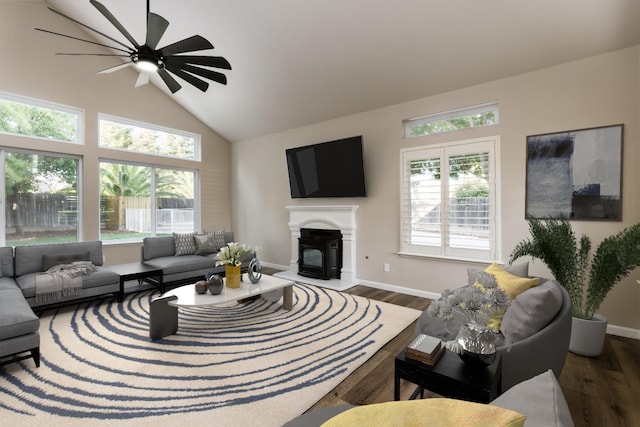 2176 E Pinehurst Ave, Fresno, CA 93730 - living room with plenty of natural light, ceiling fan, wood finished floors, and high vaulted ceiling