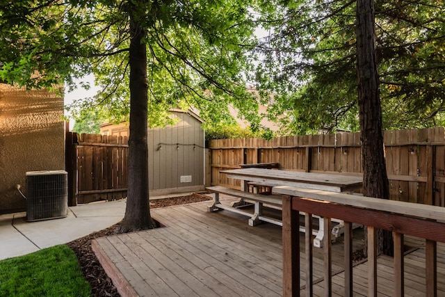 2176 E Pinehurst Ave, Fresno, CA 93730 - deck featuring central air condition unit and a fenced backyard