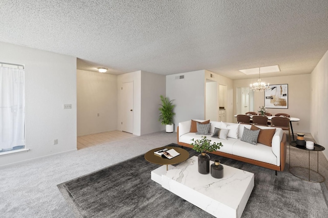1709 W Calimyrna Ave Unit B, Fresno, CA 93711 - carpeted living area with a chandelier and a textured ceiling