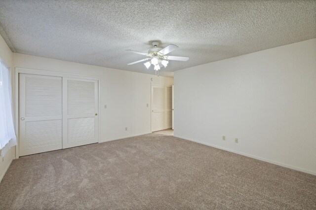 1709 W Calimyrna Ave Unit B, Fresno, CA 93711 - unfurnished bedroom with carpet flooring, a textured ceiling, baseboards, and ceiling fan
