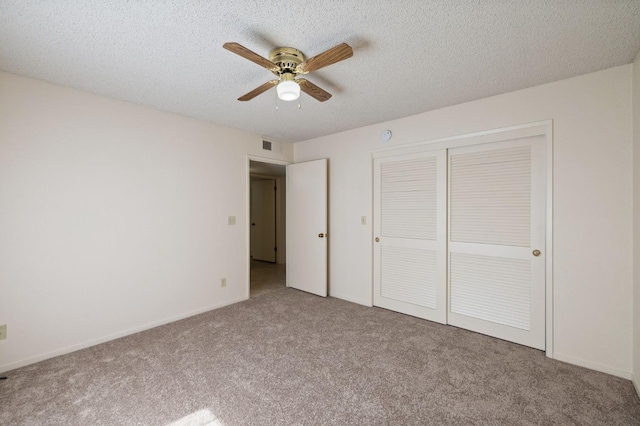 1709 W Calimyrna Ave Unit B, Fresno, CA 93711 - unfurnished bedroom featuring carpet, a closet, a textured ceiling, baseboards, and a ceiling fan