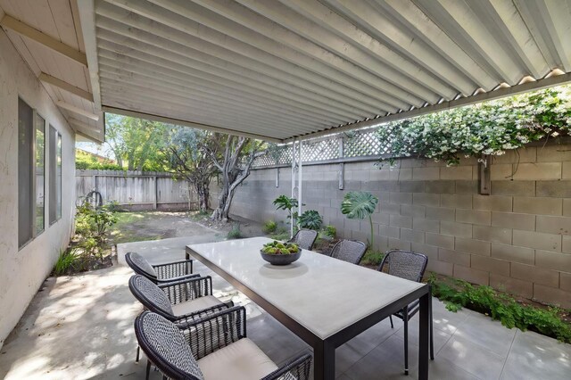 1709 W Calimyrna Ave Unit B, Fresno, CA 93711 - fenced backyard featuring outdoor dining area and a patio area