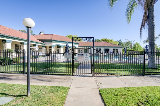 1542 E Alluvial Ave Unit 224, Fresno, CA 93720 - view of front of house with a gate and a community pool