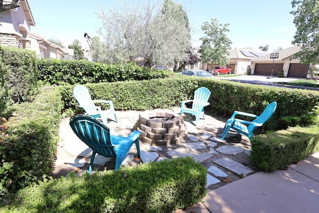 2143 Everglade Ave, Clovis, CA 93619 - view of patio / terrace with a fire pit and a residential view
