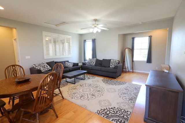 2143 Everglade Ave, Clovis, CA 93619 - living room featuring light wood-type flooring, attic access, and a ceiling fan