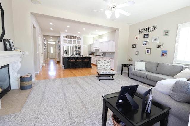 2143 Everglade Ave, Clovis, CA 93619 - living area with ceiling fan, recessed lighting, a fireplace with flush hearth, and baseboards