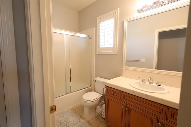 2143 Everglade Ave, Clovis, CA 93619 - full bath featuring toilet, vanity, combined bath / shower with glass door, and tile patterned floors