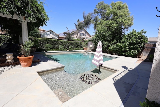 2143 Everglade Ave, Clovis, CA 93619 - view of swimming pool featuring a patio area and a fenced backyard