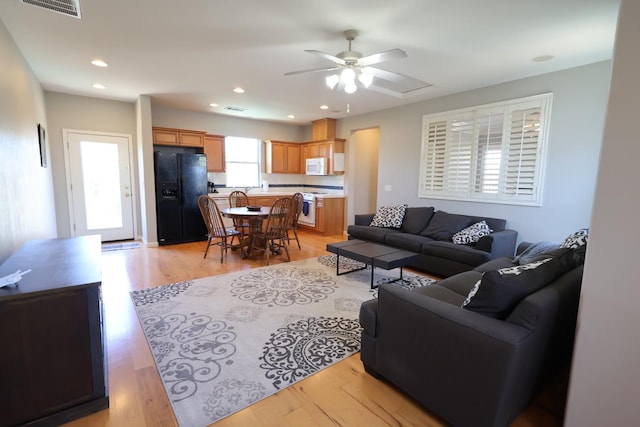 2143 Everglade Ave, Clovis, CA 93619 - living room featuring ceiling fan, light wood-type flooring, and recessed lighting