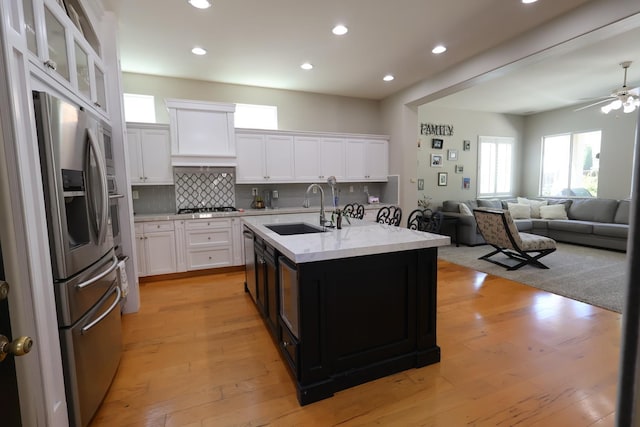2143 Everglade Ave, Clovis, CA 93619 - kitchen featuring stainless steel appliances, a sink, plenty of natural light, tasteful backsplash, and recessed lighting