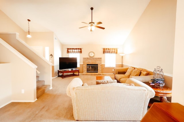 1866 E Goshen Ave, Fresno, CA 93720 - living area with lofted ceiling, ceiling fan, light colored carpet, baseboards, and a fireplace