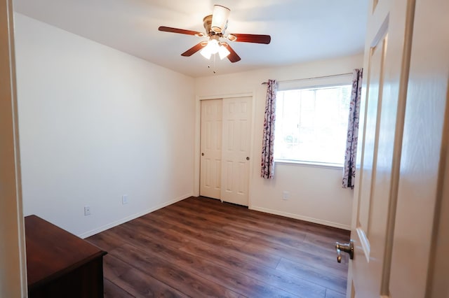 1866 E Goshen Ave, Fresno, CA 93720 - spare room featuring dark wood finished floors, a ceiling fan, and baseboards