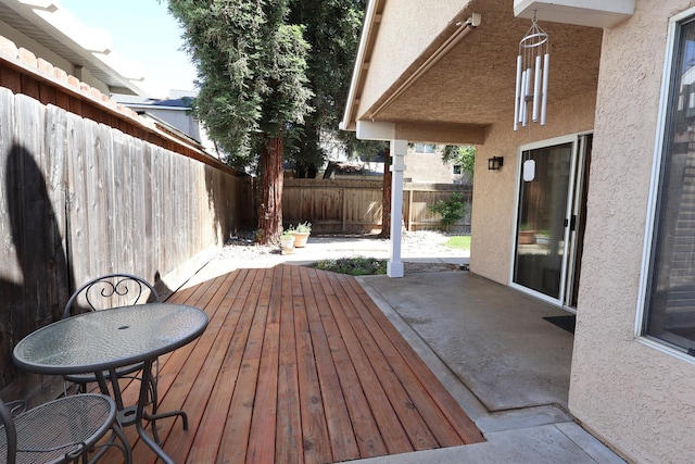1866 E Goshen Ave, Fresno, CA 93720 - wooden deck featuring a fenced backyard and a patio area