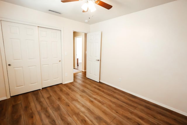 1866 E Goshen Ave, Fresno, CA 93720 - unfurnished bedroom featuring wood finished floors, baseboards, a closet, and ceiling fan
