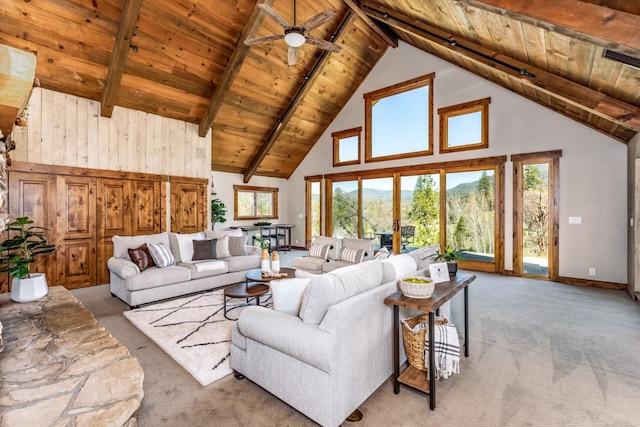 55606 Rd 226, North Fork, CA 93643 - living area with wood ceiling with exposed beams, carpet flooring, high vaulted ceiling, a ceiling fan, and baseboards