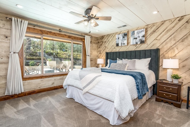 55606 Rd 226, North Fork, CA 93643 - bedroom with wooden walls, carpet flooring, recessed lighting, access to outside, and a ceiling fan