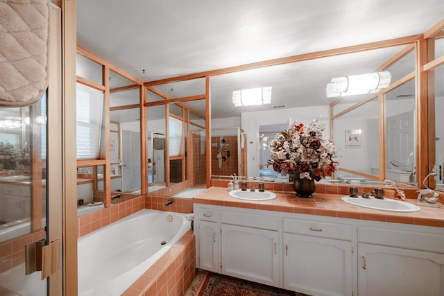 9109 N Chadwick Ln, Fresno, CA 93720 - full bath featuring double vanity, a garden tub, and a stall shower