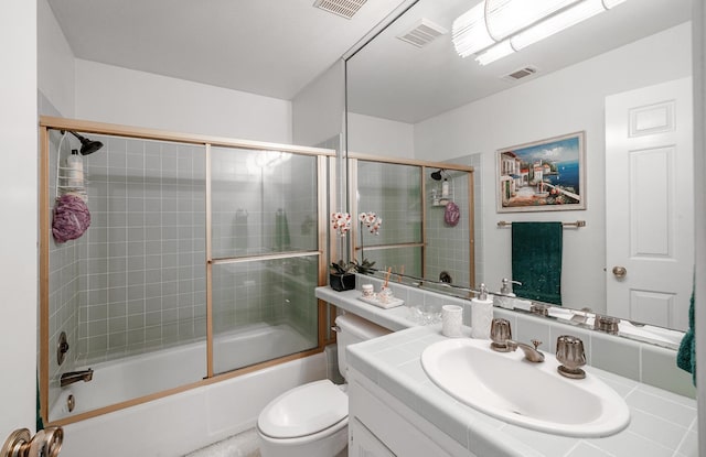 9109 N Chadwick Ln, Fresno, CA 93720 - full bath featuring vanity, combined bath / shower with glass door, and toilet